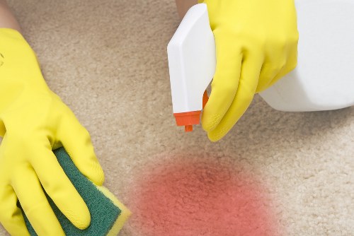 Professional carpet cleaner in Ruislip deep cleaning a living room carpet