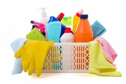 Cleaner using PPE while working in a property