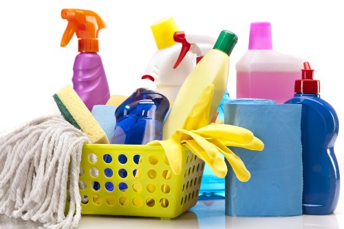 Cleaner following safe working practices during a cleaning task