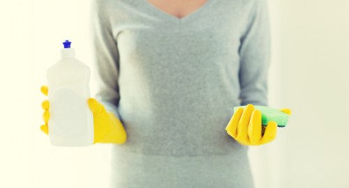 Cleaner preparing a living space during one off cleaning in Ruislip