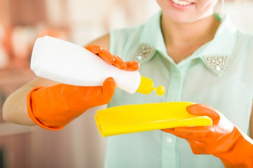 Technician using safe cleaning methods on a property facade