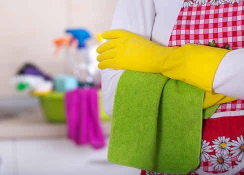 Local office cleaners in Ruislip vacuuming and dusting a modern workspace