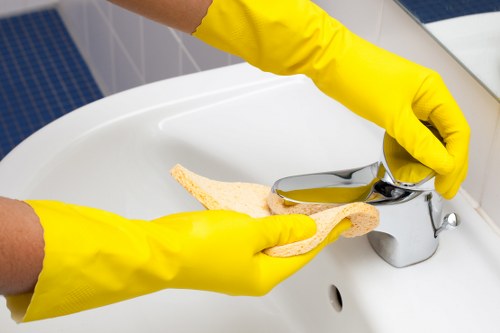 Domestic cleaning service preparing a kitchen in a Ruislip home